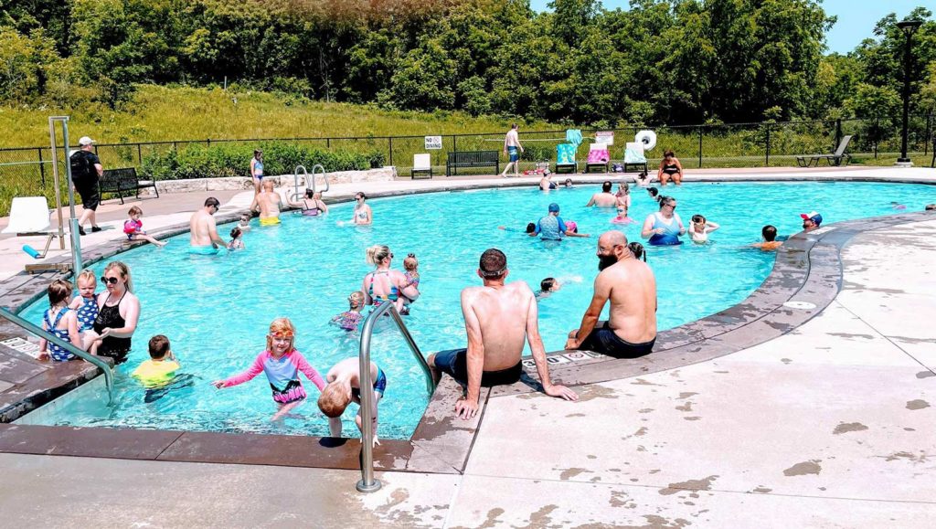 Children and adults enjoy the outdoor pool at Blue Mound State Park