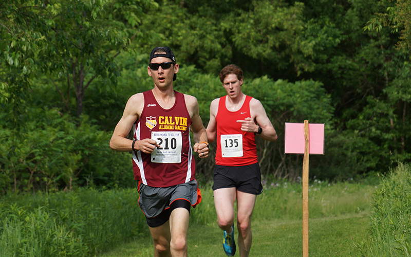 Two runners competing during a trail race